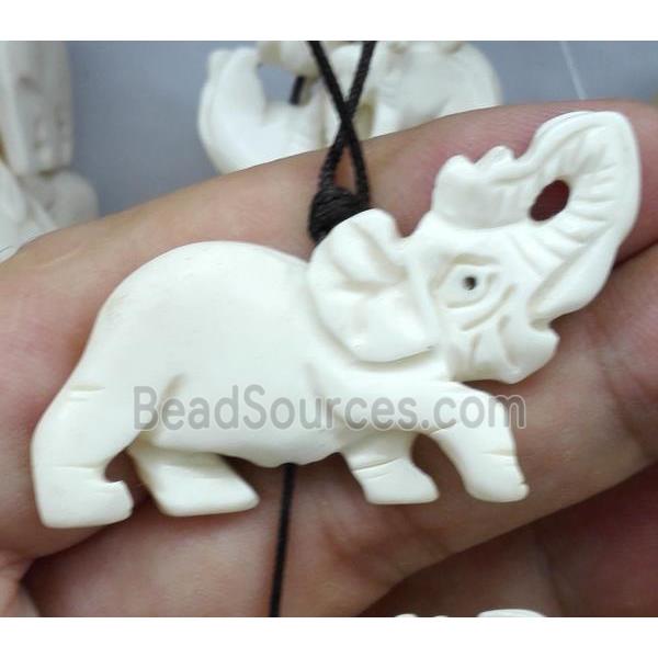 white antique cattle bone beads, elephant