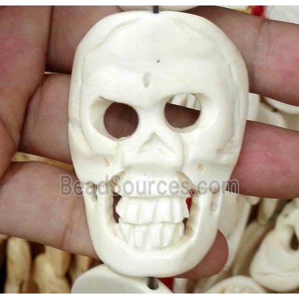 antique cattle bone beads, skull charm, white