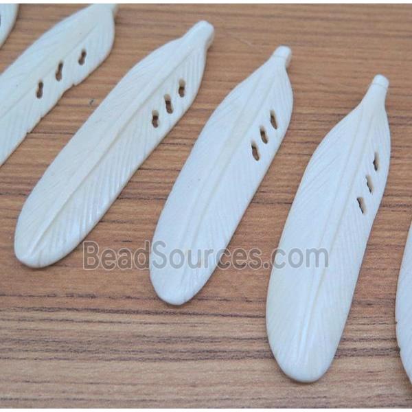 bone pendant, feather, white