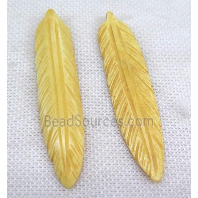 yellow bone feather pendant