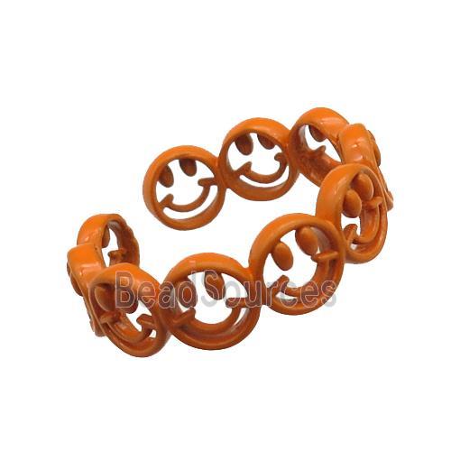 copper rings with orange lacquered