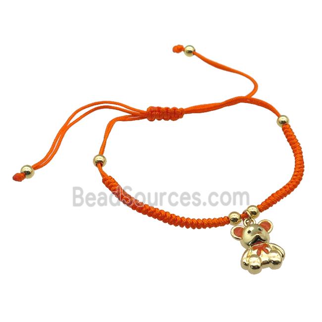 orange nylon bracelet with copper bear, adjustable