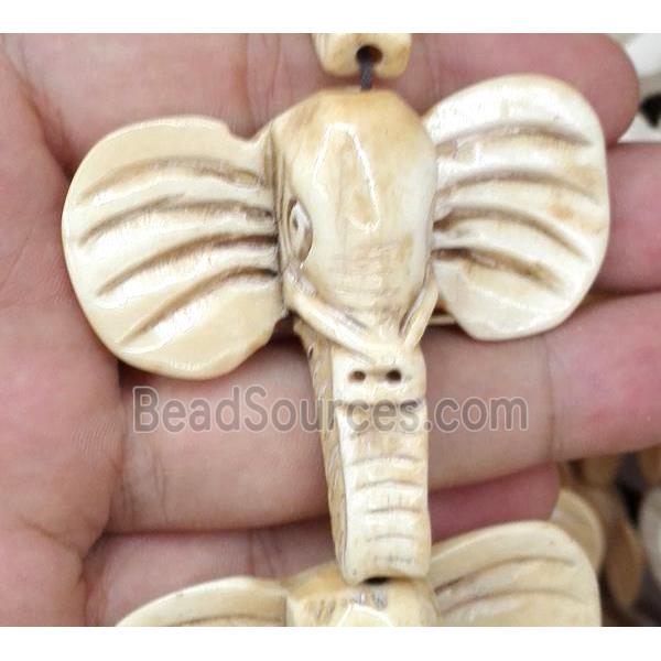 antique cattle bone beads, elephant, yellow