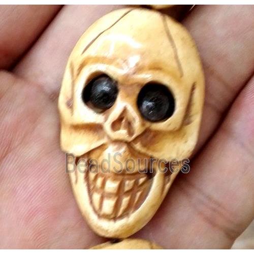 antique cattle bone beads, skull, yellow