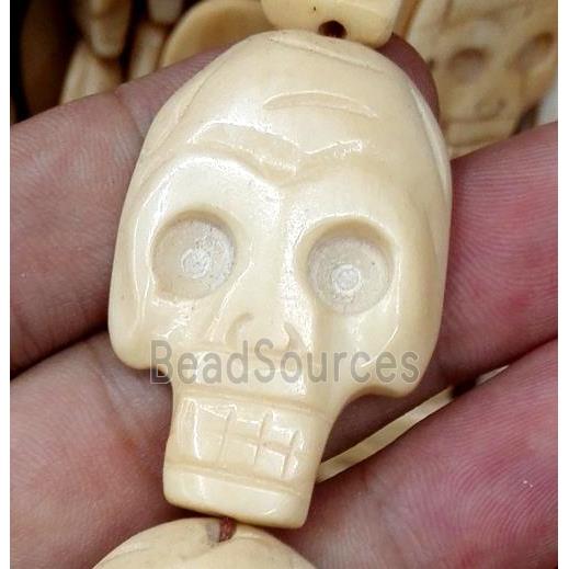 antique cattle bone beads, skull, yellow