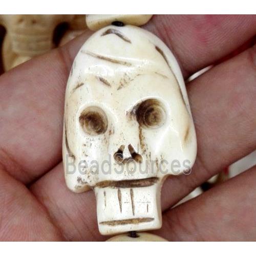 white antique cattle bone beads, skull