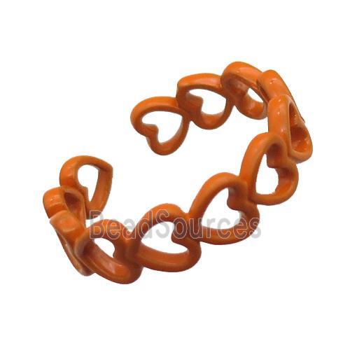 copper rings with orange lacquered