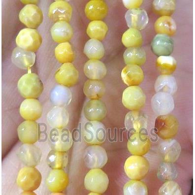 Tiny yellow agate bead, faceted round