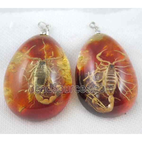 Amber teardrop pendant with scorpion, orange, NR