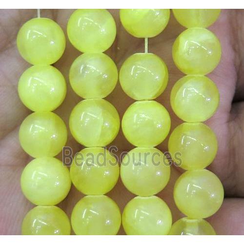 yellow jade bead, round, stabile