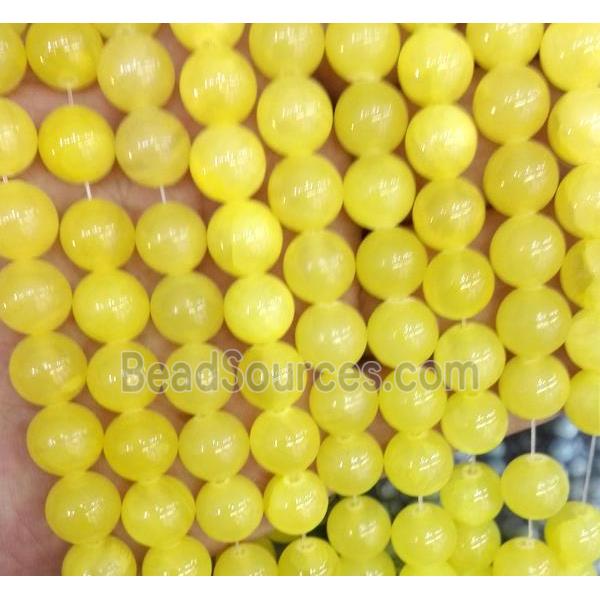 yellow jade bead, round, stabile