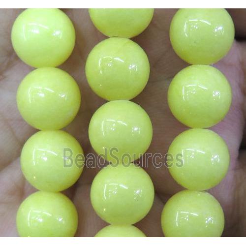 yellow jade bead, round, stabile