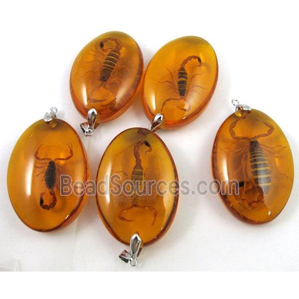 amber pendant, oval, golden