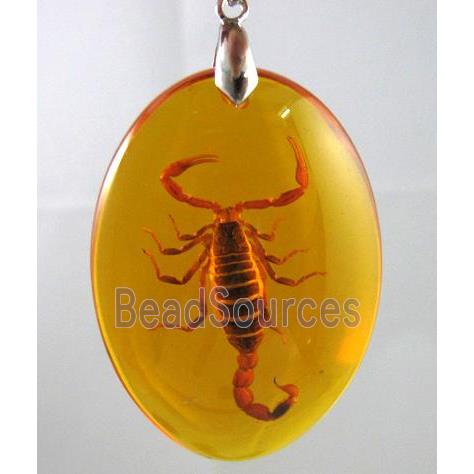 amber pendant, oval, golden